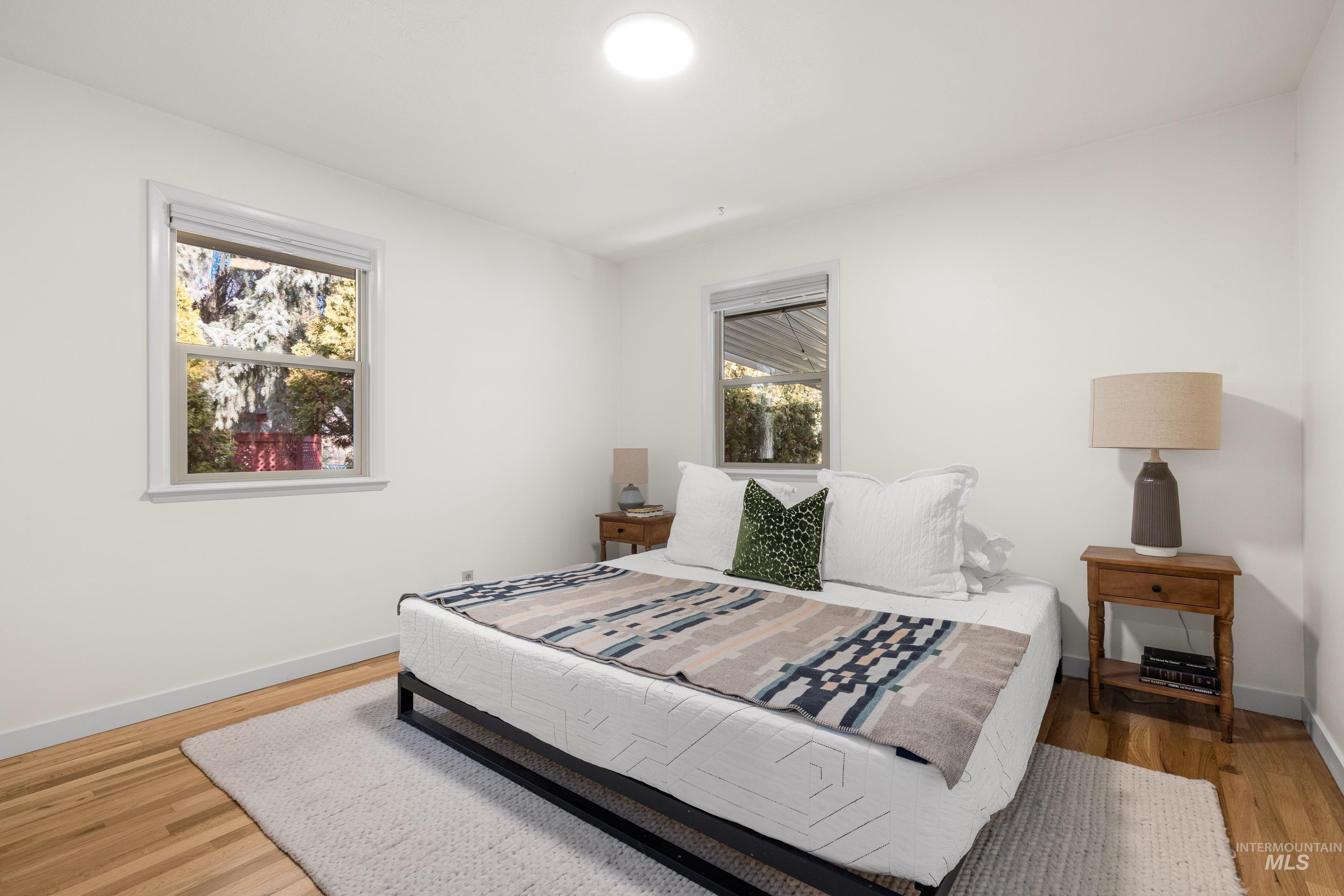 1010 Forrest Street Boise, ID 83705 - Photo 19 of 50 Bedroom with light wood-style floors and baseboards