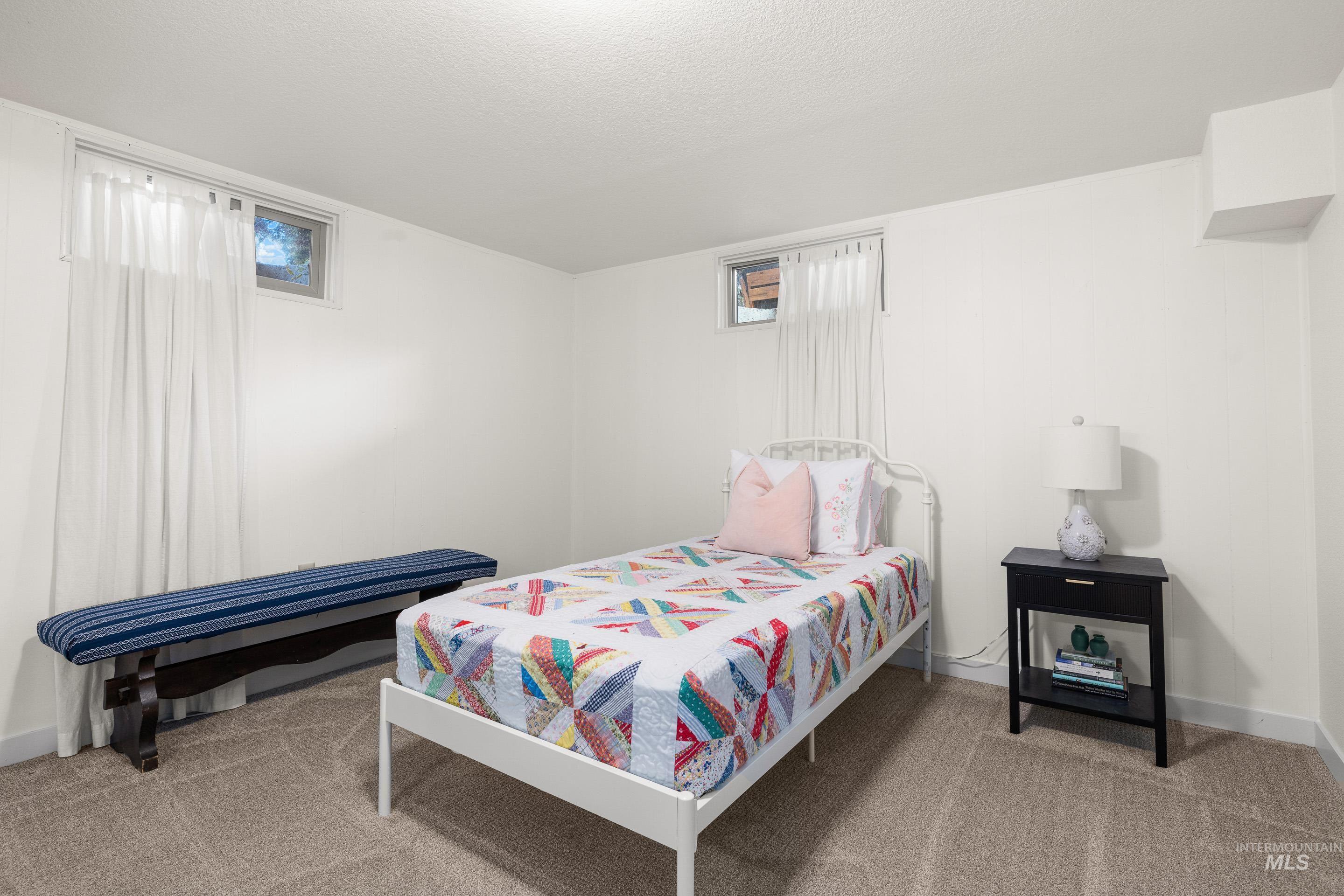 1010 Forrest Street Boise, ID 83705 - Photo 27 of 50 Bedroom with light colored carpet and a textured ceiling