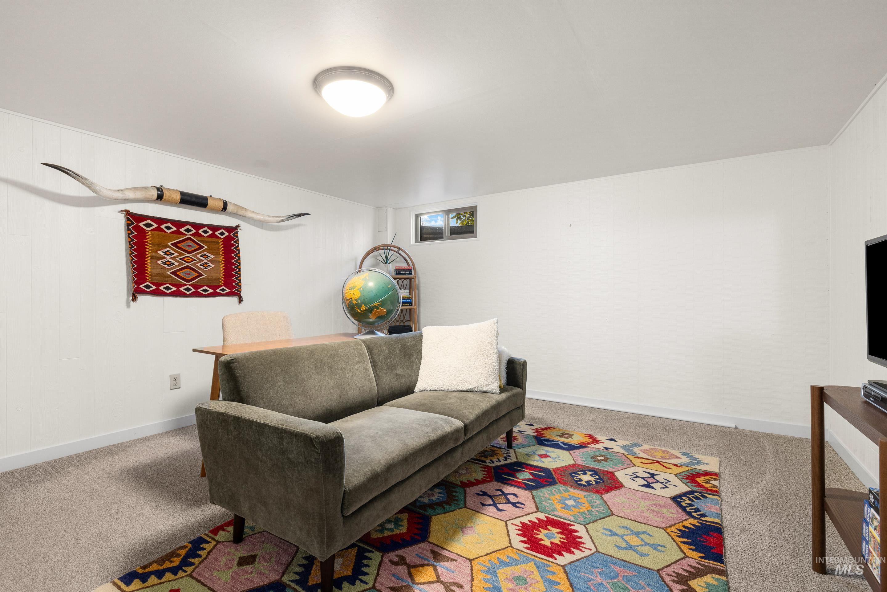 1010 Forrest Street Boise, ID 83705 - Photo 31 of 50 Living area with carpet floors and baseboards