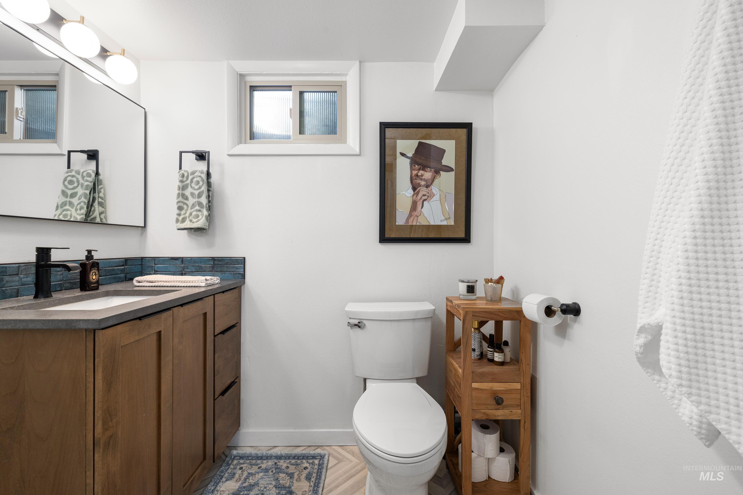 1010 Forrest Street Boise, ID 83705 - Photo 33 of 50 Half bathroom with vanity and toilet