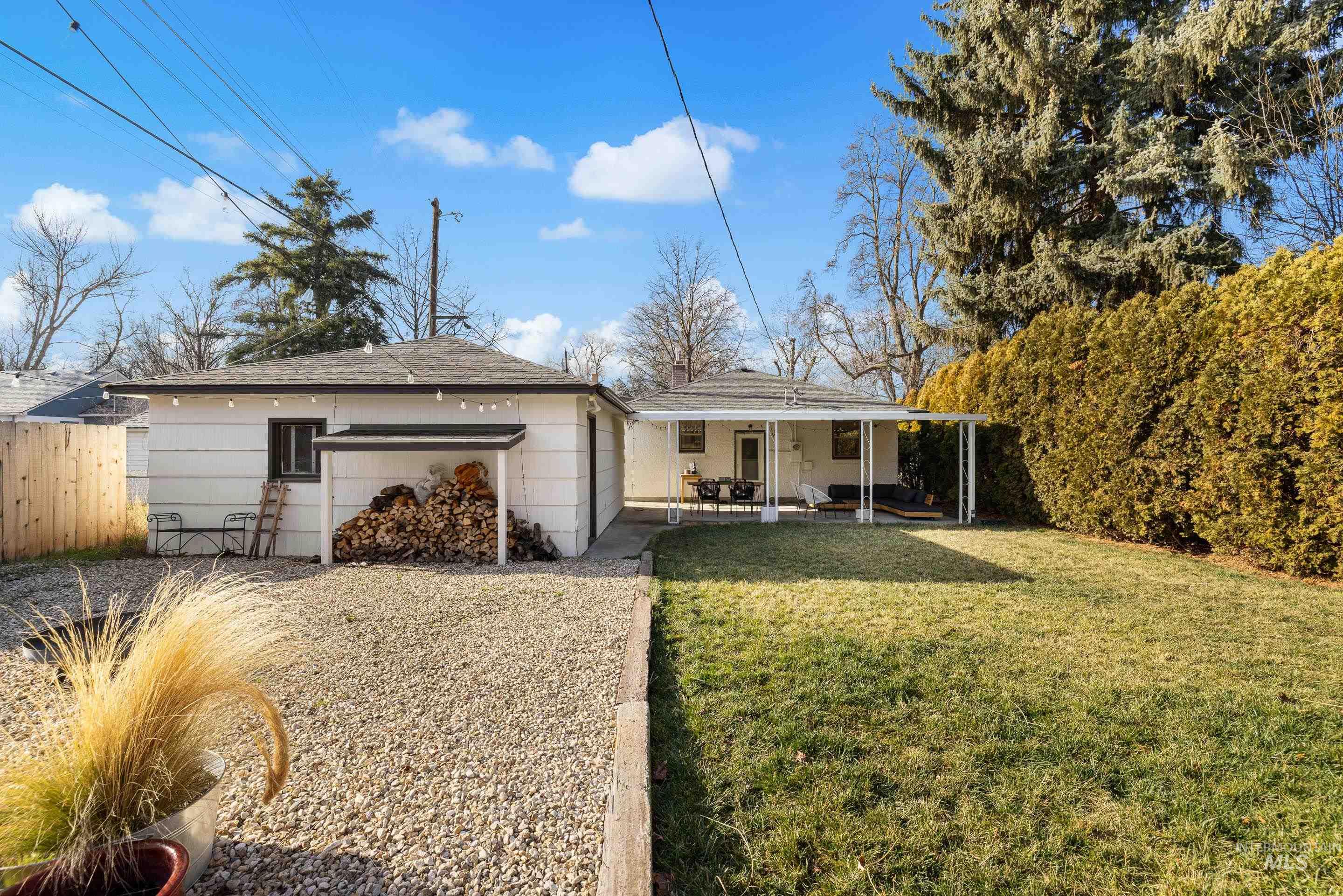 1010 Forrest Street Boise, ID 83705 - Photo 40 of 50 Back of house featuring a patio area and a shingled roof