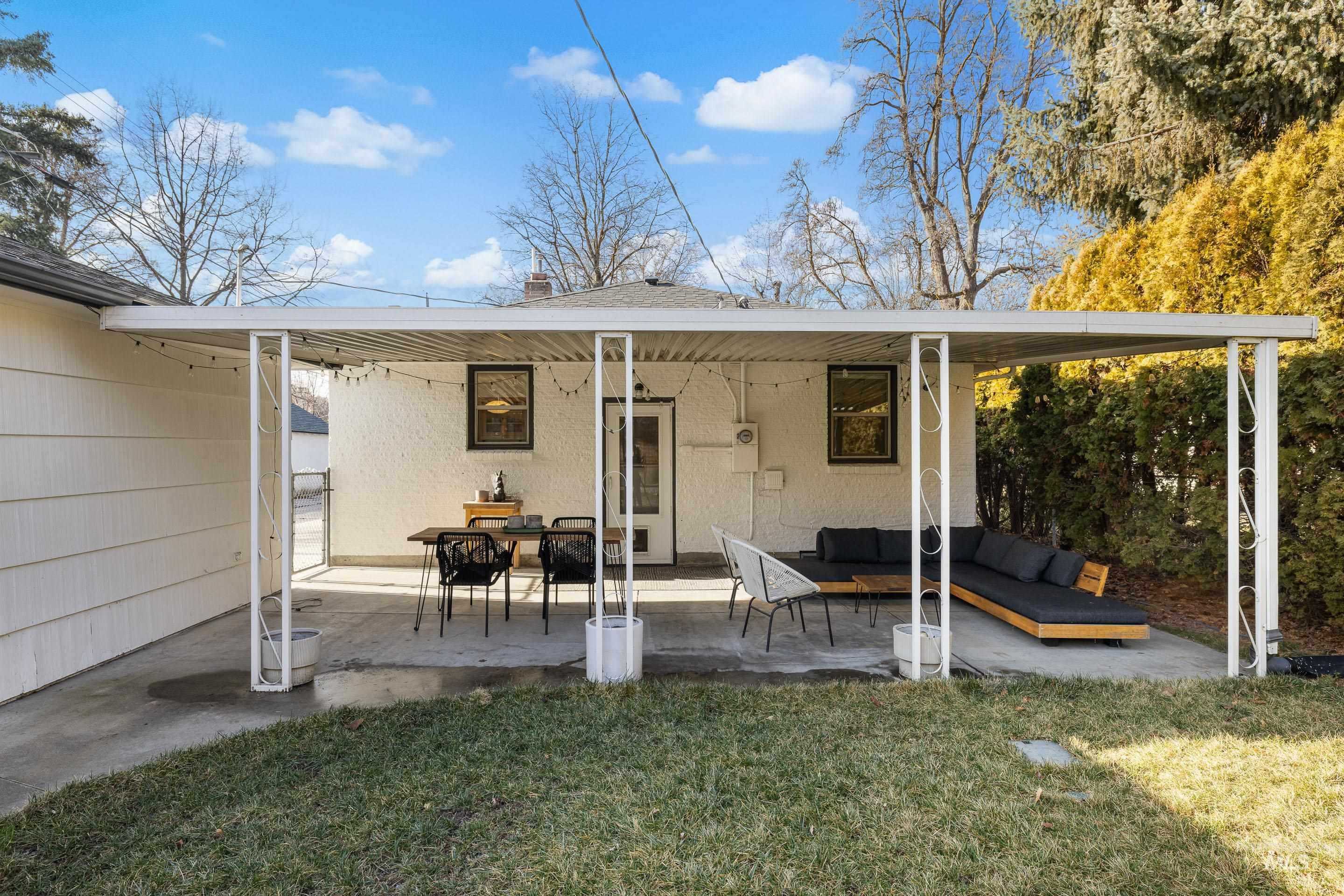 1010 Forrest Street Boise, ID 83705 - Photo 41 of 50 Back of property featuring a patio area, a yard, and an outdoor hangout area