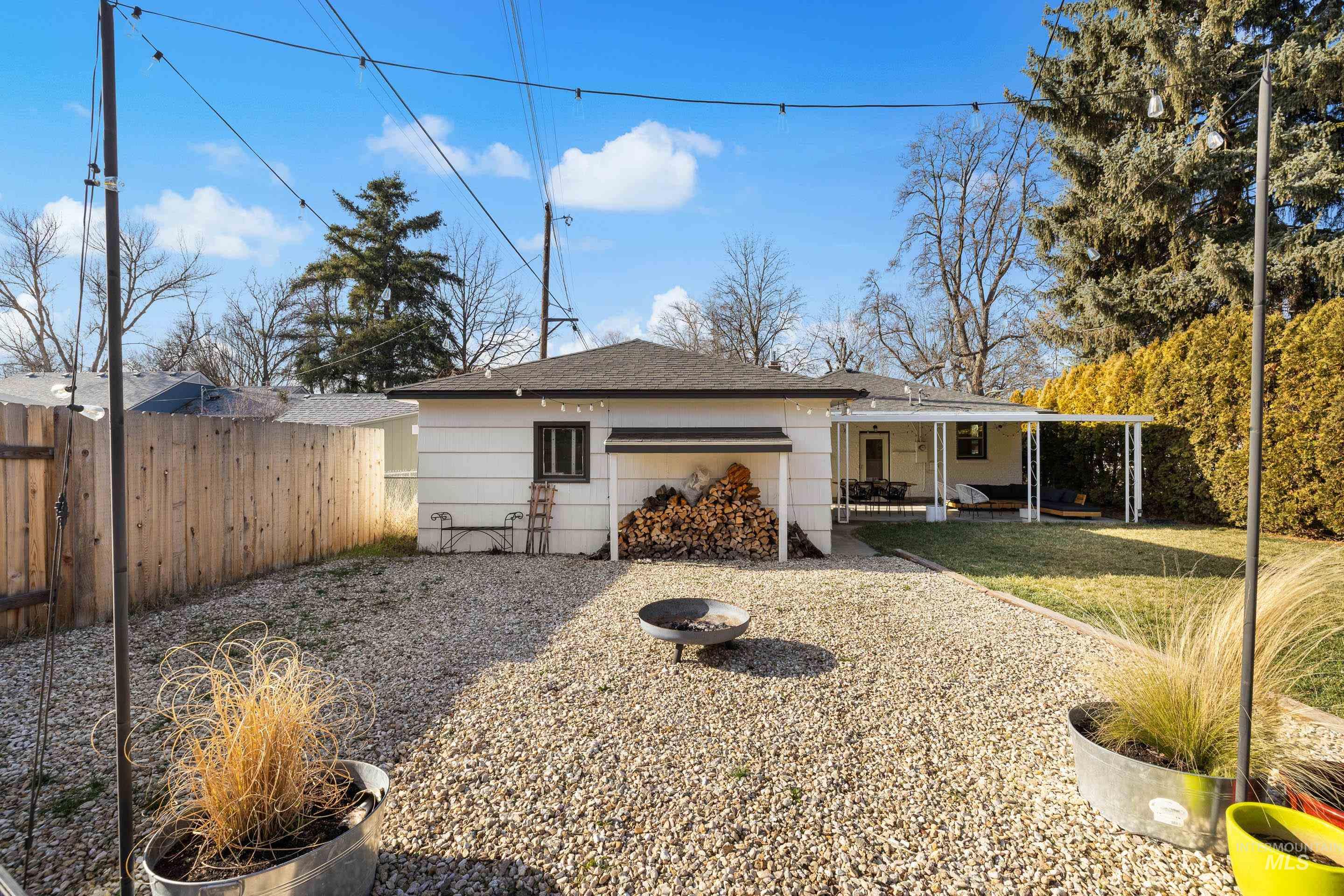 1010 Forrest Street Boise, ID 83705 - Photo 44 of 50 Back of house featuring a fire pit and a patio area