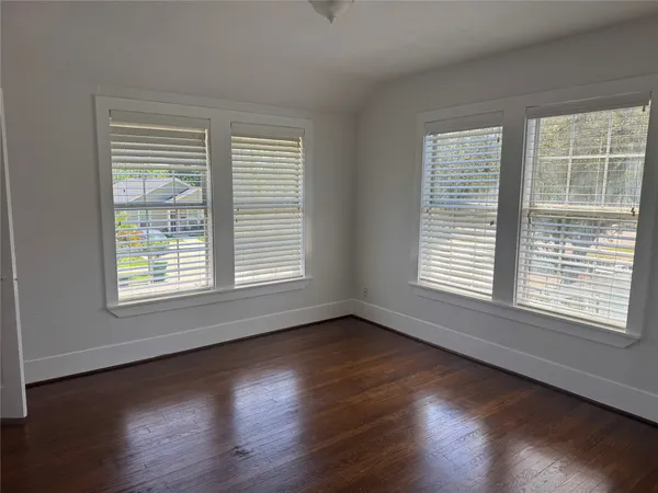 a kitchen with wooden floor and a sink