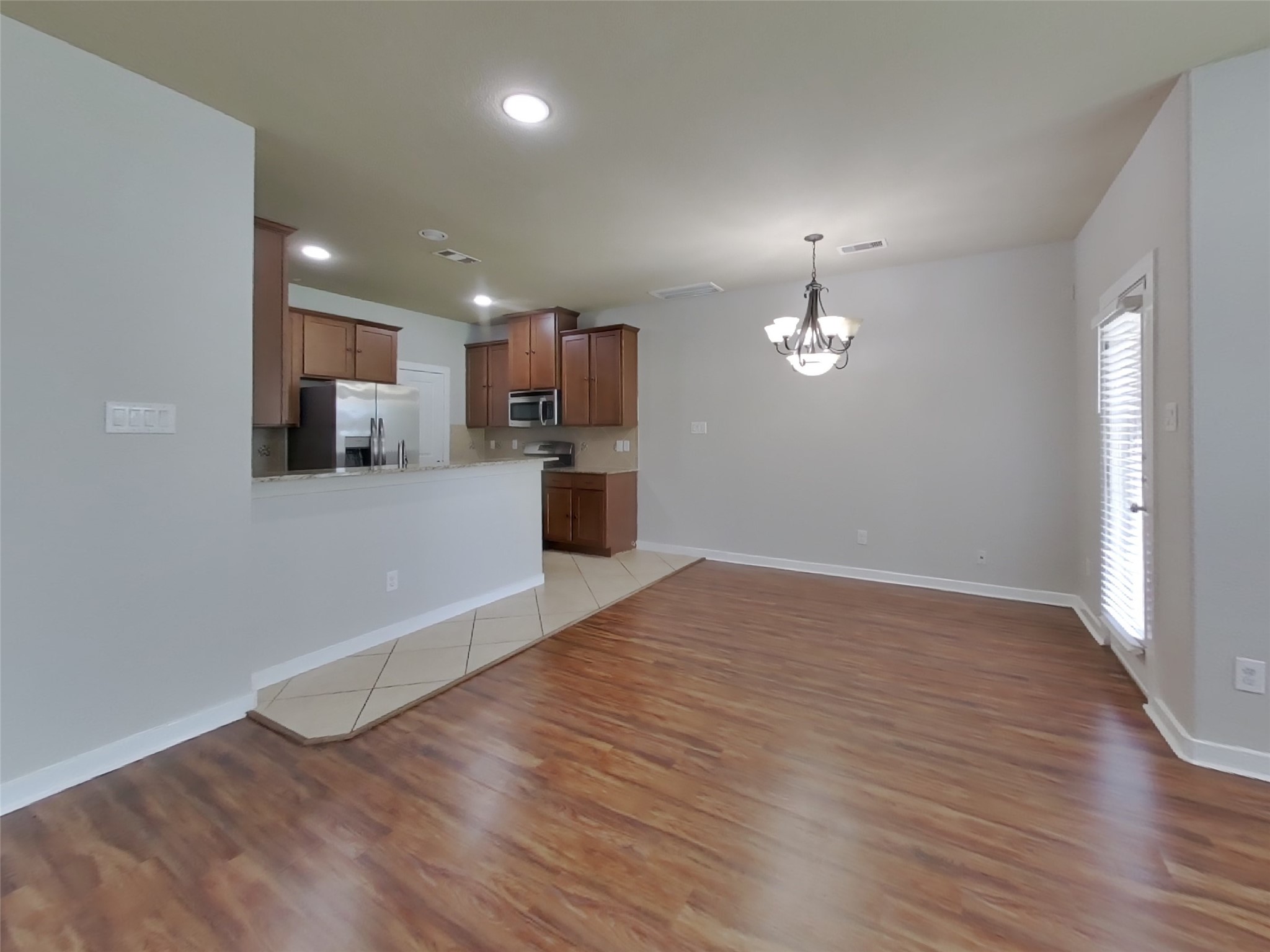1819 Jara Court Spring, TX 77388 - Photo 2 of 19 a view of a kitchen with a sink and a refrigerator