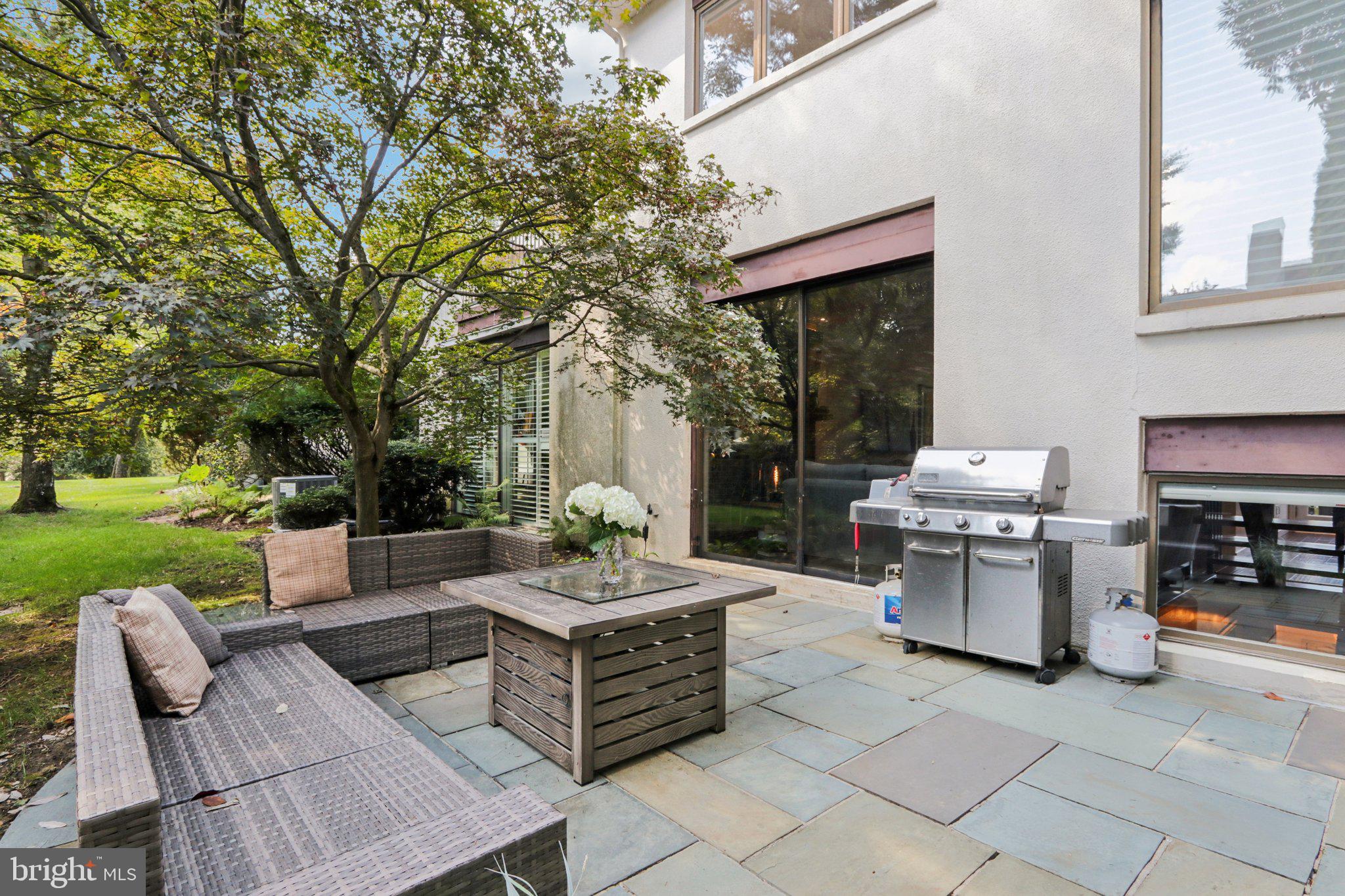 6 Avignon Devon, PA 19333 - Photo 18 of 61 a outdoor space with patio furniture and garden