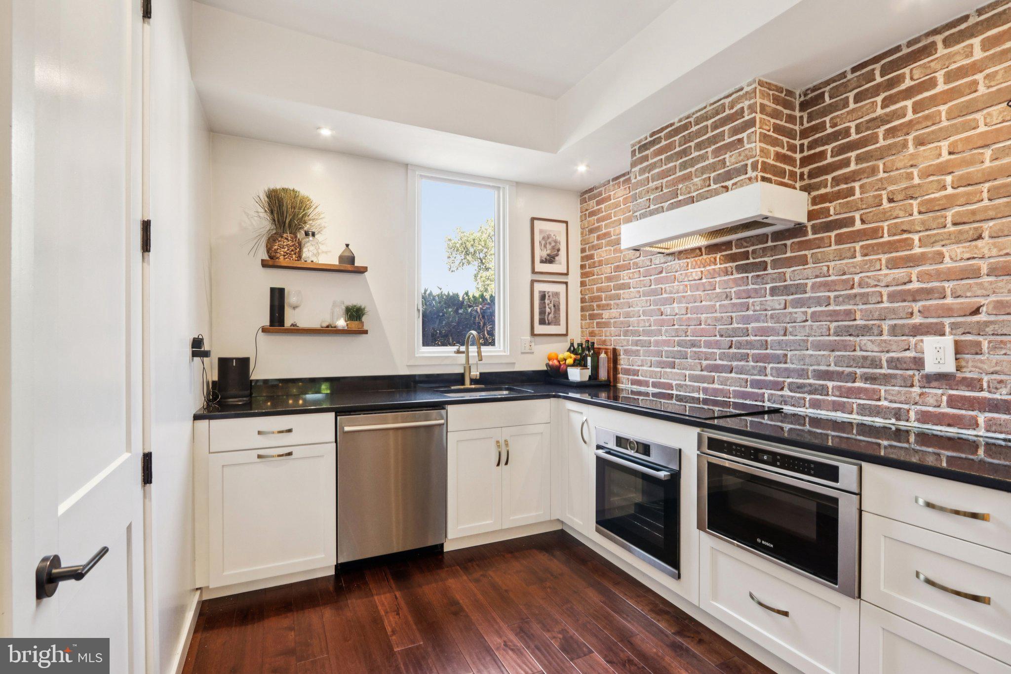 6 Avignon Devon, PA 19333 - Photo 20 of 61 a kitchen with stainless steel appliances a stove sink and cabinets