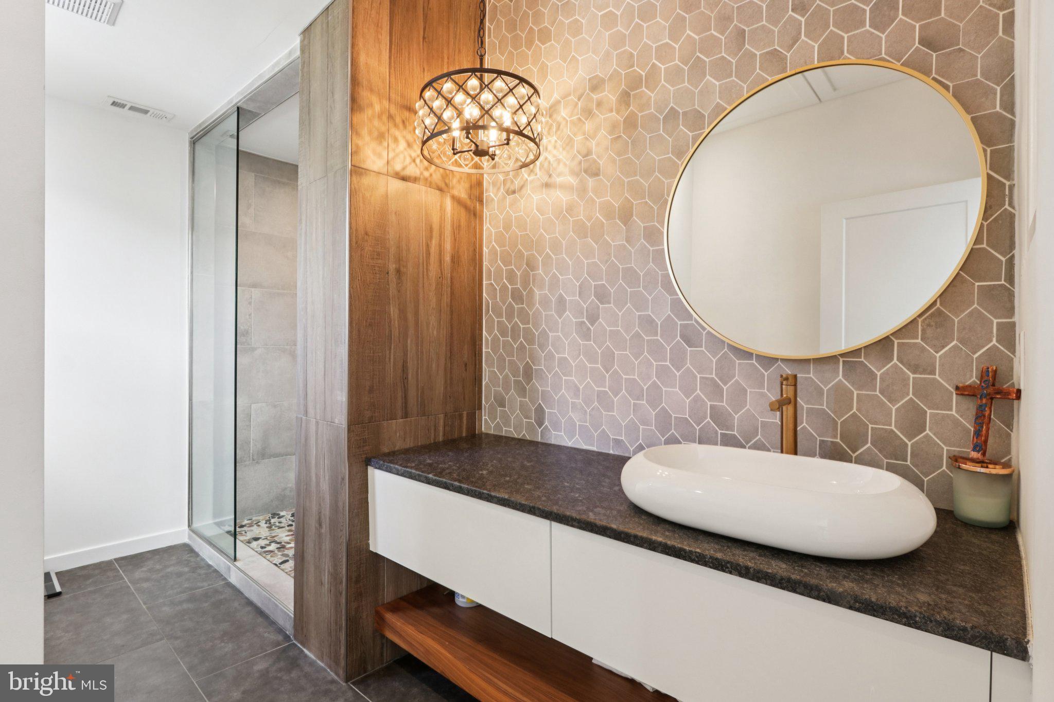 6 Avignon Devon, PA 19333 - Photo 31 of 61 a bathroom with a sink mirror and vanity