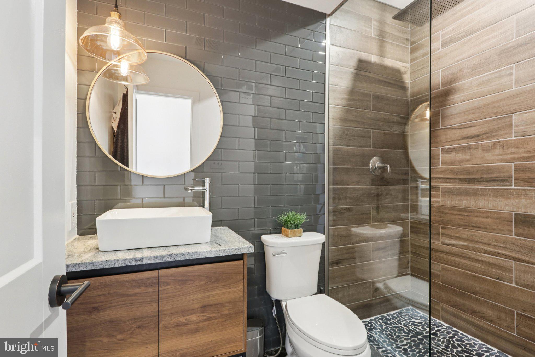 6 Avignon Devon, PA 19333 - Photo 38 of 61 a bathroom with a toilet a sink and mirror