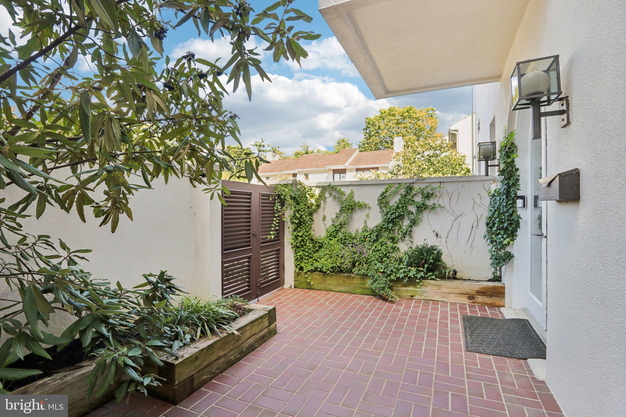 6 Avignon Devon, PA 19333 - Photo 4 of 61 a view of a garden with plants