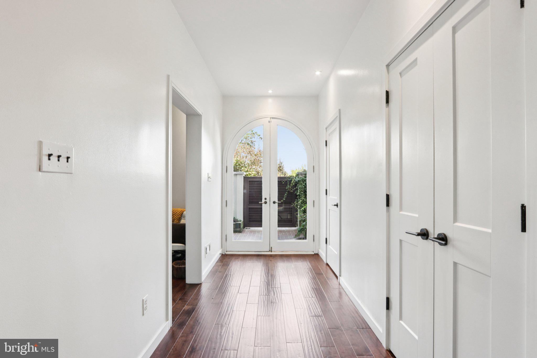 6 Avignon Devon, PA 19333 - Photo 6 of 61 a view of a hallway with wooden floor and closet area