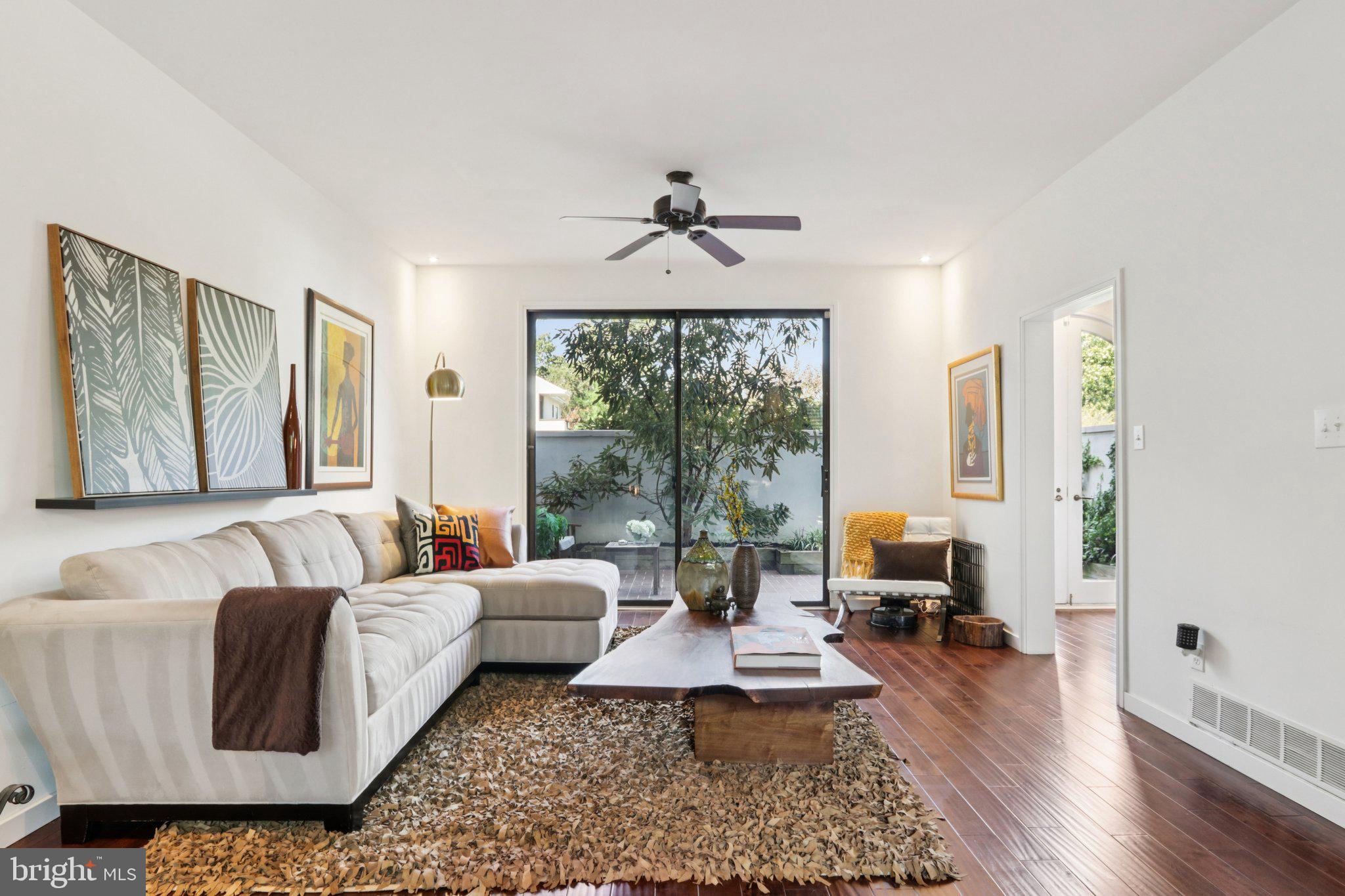 6 Avignon Devon, PA 19333 - Photo 9 of 61 a living room with furniture and a large window