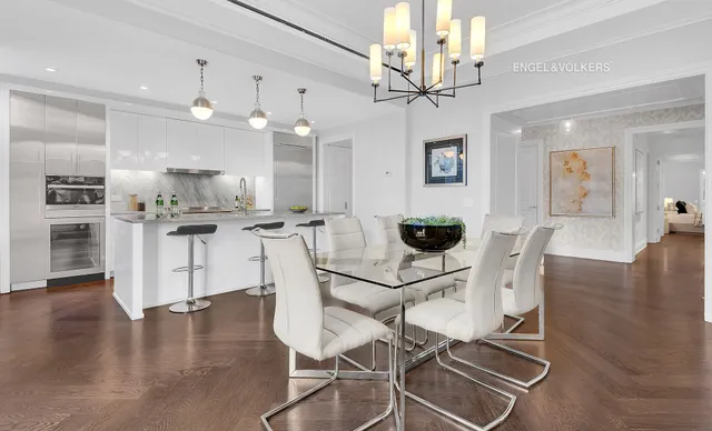 a kitchen with stainless steel appliances granite countertop a sink a stove and a refrigerator