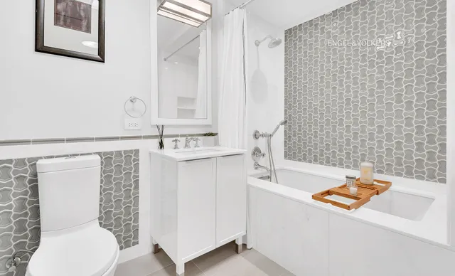 a bedroom with a bed and a lamp