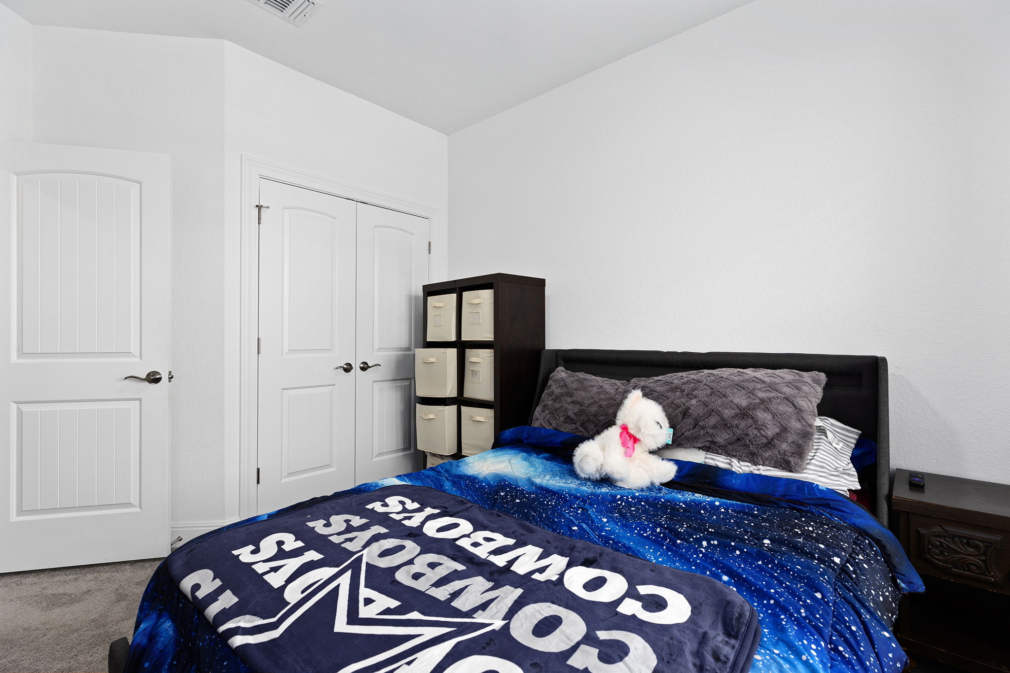 116 Raleigh Drive Georgetown, TX 78633 - Photo 20 of 28 White paneled doors enhance the bright aesthetic of this cozy bedroom.