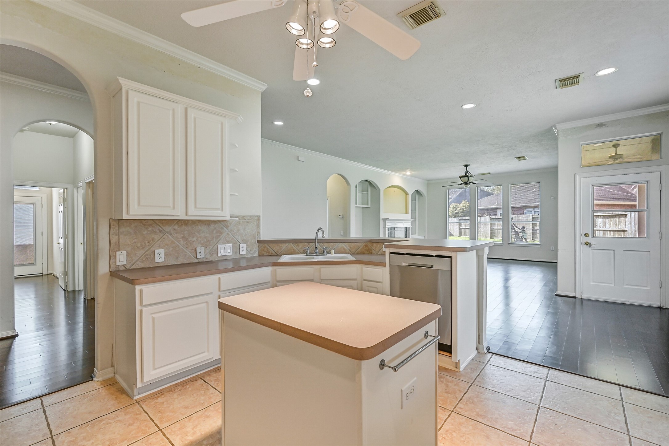 1448 North Riviera Circle Pearland, TX 77581 - Photo 13 of 35 View from the back of the kitchen looking toward the family room, emphasizing the open-concept design.