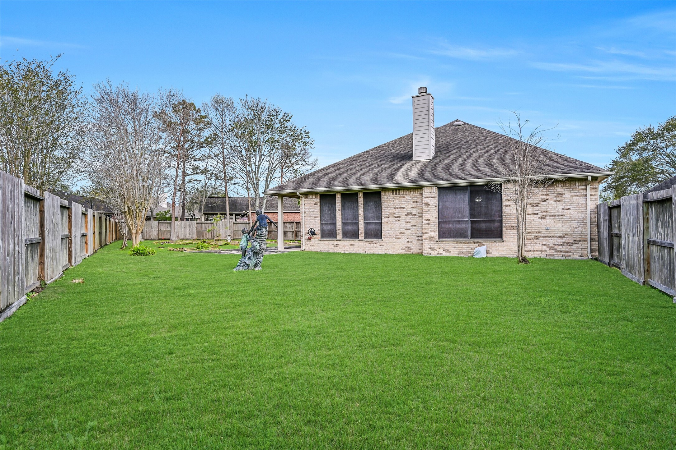 1448 North Riviera Circle Pearland, TX 77581 - Photo 24 of 35 Additional view highlighting the large lot and open backyard space along the side of the home.
