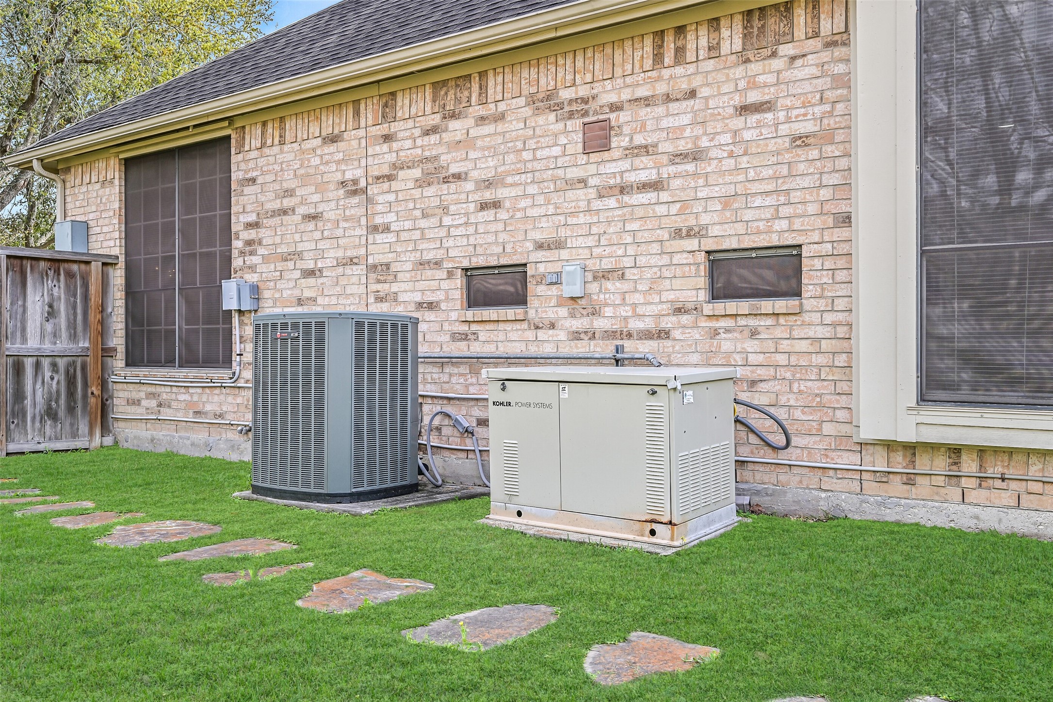 1448 North Riviera Circle Pearland, TX 77581 - Photo 25 of 35 Whole house generator provides added peace of mind.