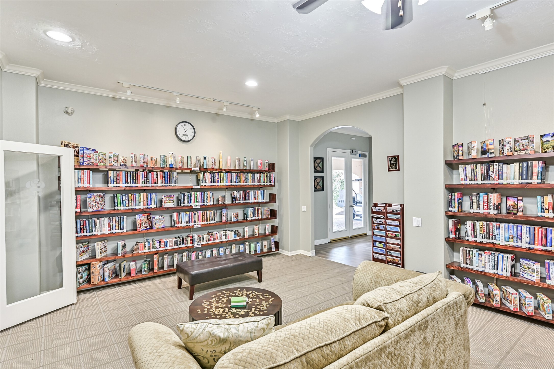 1448 North Riviera Circle Pearland, TX 77581 - Photo 30 of 35 Community clubhouse library offers a quiet and comfortable space for residents to relax, read, or gather with neighbors. One of the many thoughtfully designed amenities that make Bellavita such a special place to call home.