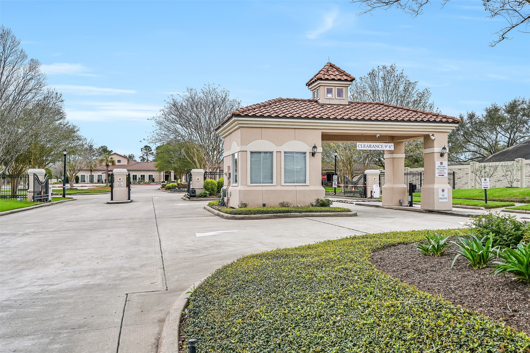 1448 North Riviera Circle Pearland, TX 77581 - Photo 33 of 35 Bellavita features a gated entrance with guardhouse and beautifully maintained landscaping for added security and peace of mind.