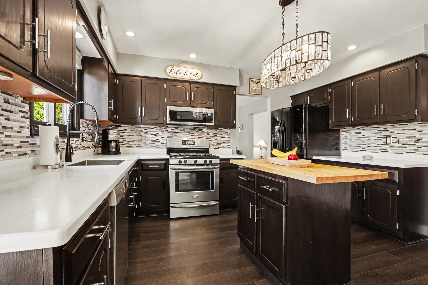237 Homewood Drive Bolingbrook, IL 60440 - Photo 13 of 37 a kitchen with stainless steel appliances a sink stove and refrigerator