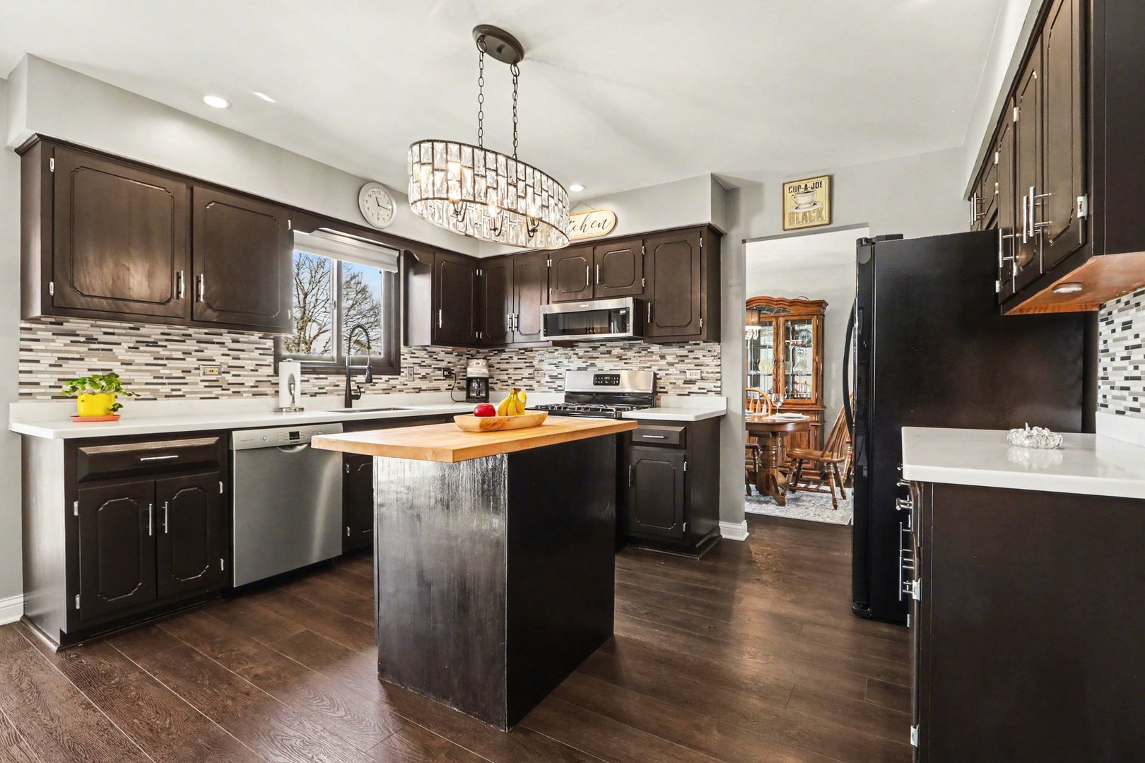 237 Homewood Drive Bolingbrook, IL 60440 - Photo 15 of 37 a kitchen with stainless steel appliances granite countertop a stove refrigerator and microwave