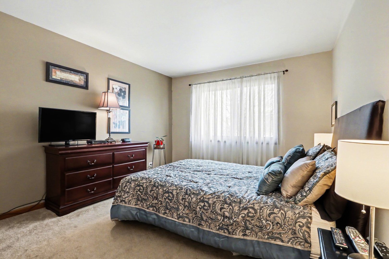 237 Homewood Drive Bolingbrook, IL 60440 - Photo 25 of 37 a bedroom with a bed and a flat screen tv