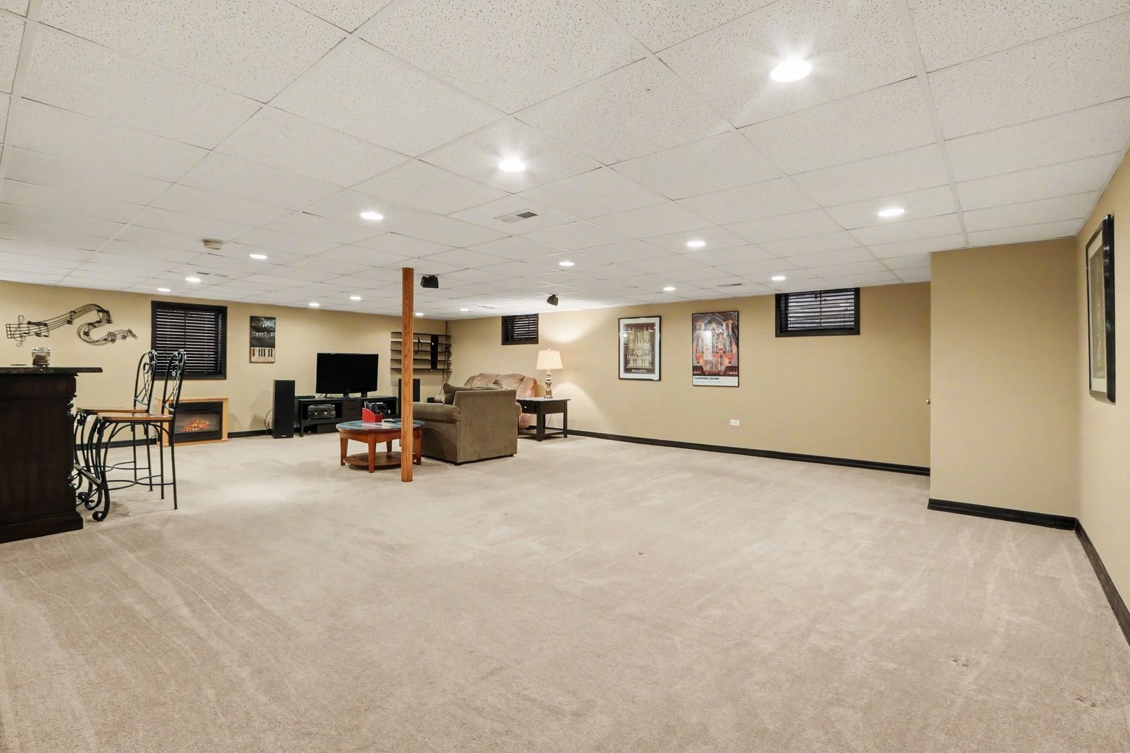 237 Homewood Drive Bolingbrook, IL 60440 - Photo 31 of 37 a view of a livingroom with furniture and a flat screen tv