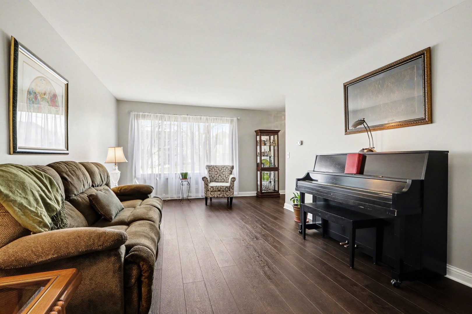 237 Homewood Drive Bolingbrook, IL 60440 - Photo 6 of 37 a living room with furniture and a wooden floor