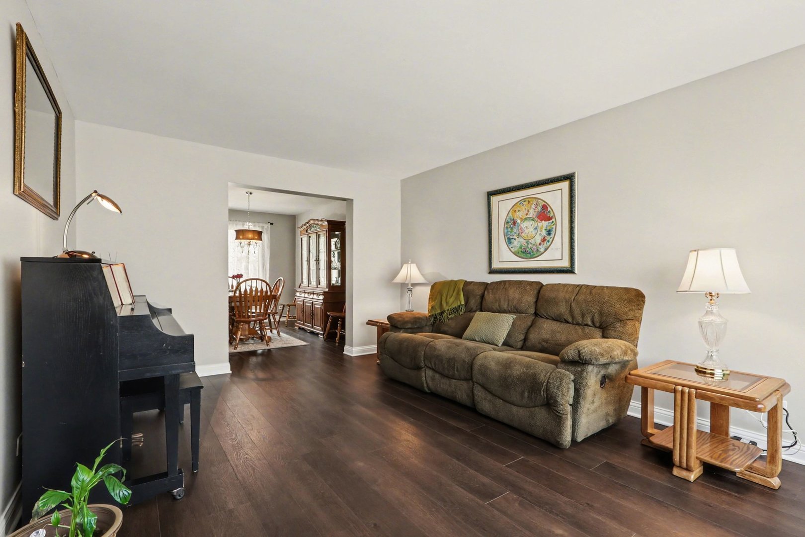 237 Homewood Drive Bolingbrook, IL 60440 - Photo 7 of 37 a living room with furniture and a lamp