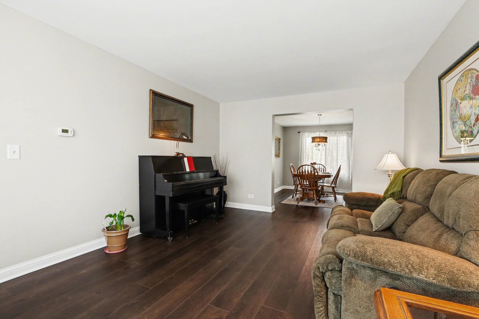 237 Homewood Drive Bolingbrook, IL 60440 - Photo 8 of 37 a living room with furniture and a wooden floor