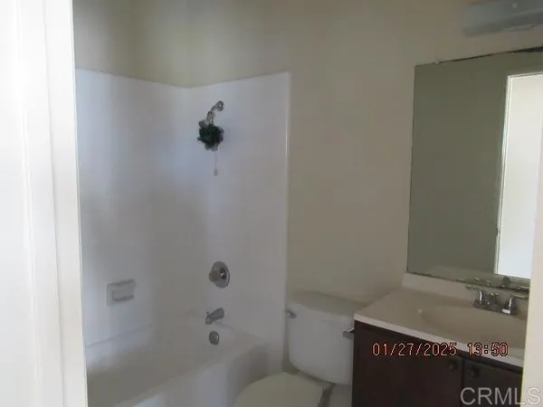 a bathroom with a shower and a toilet