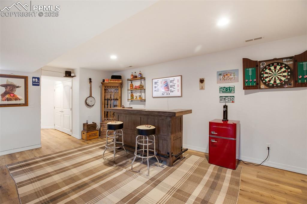 277 Aspen Circle Divide, CO 80814 - Photo 21 of 45 a view of a workspace with furniture and wooden floor