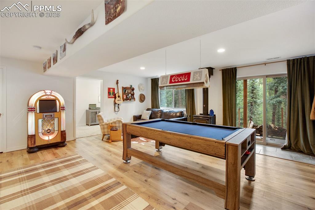 277 Aspen Circle Divide, CO 80814 - Photo 22 of 45 a living room with furniture a window and flat screen tv