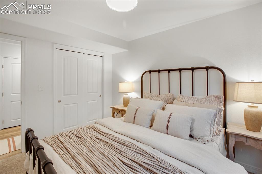 277 Aspen Circle Divide, CO 80814 - Photo 28 of 45 a large white bed in a white room