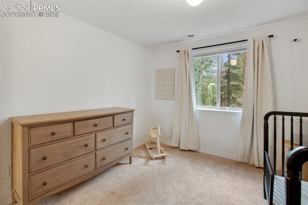 277 Aspen Circle Divide, CO 80814 - Photo 30 of 45 a view of room with cabinet and stairs