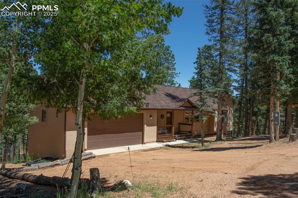 277 Aspen Circle Divide, CO 80814 - Photo 33 of 45 a view of a house with backyard and trees