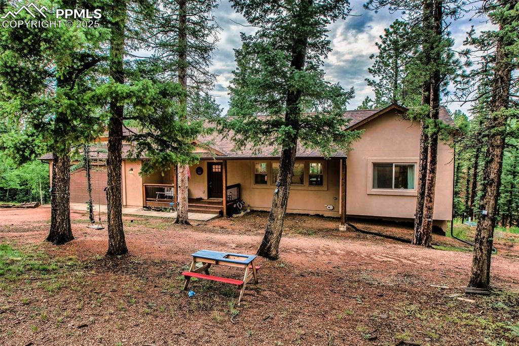 277 Aspen Circle Divide, CO 80814 - Photo 37 of 45 a backyard of a house with seating space