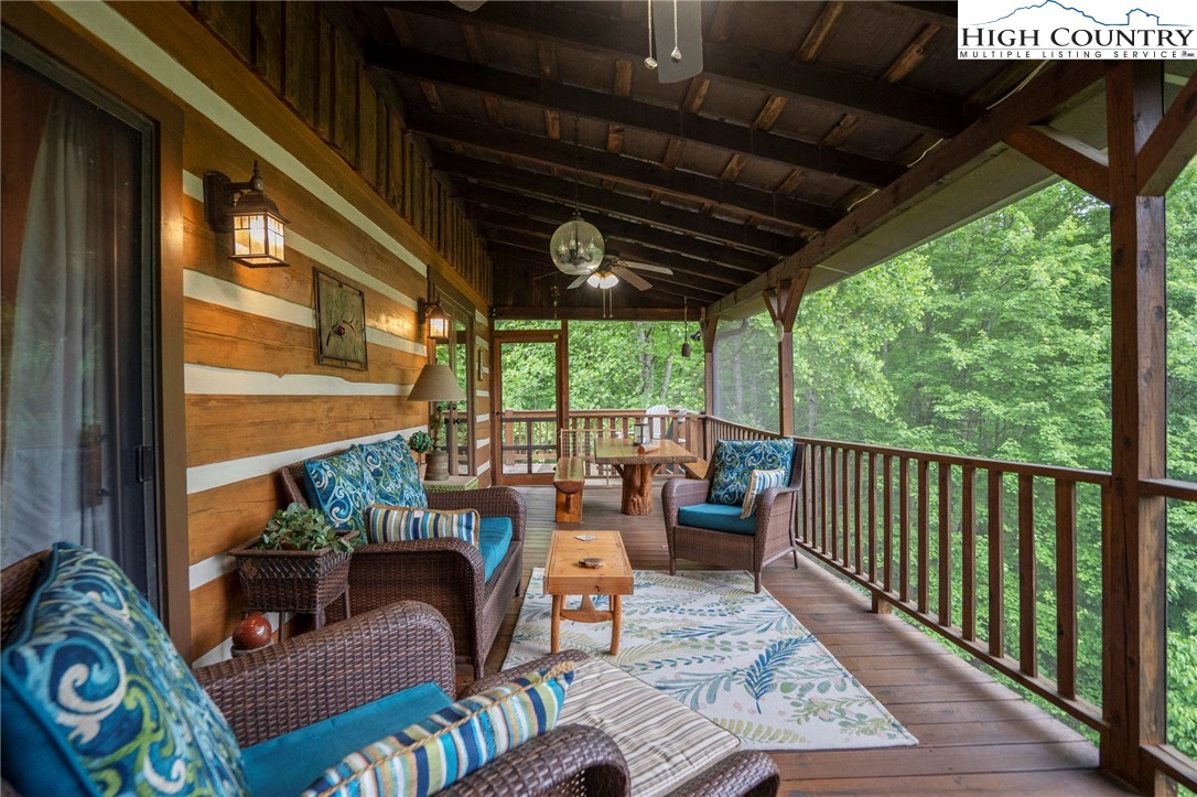 710 River Hills Road Lansing, NC 28643 - Photo 24 of 38 a view of a porch with furniture and garden