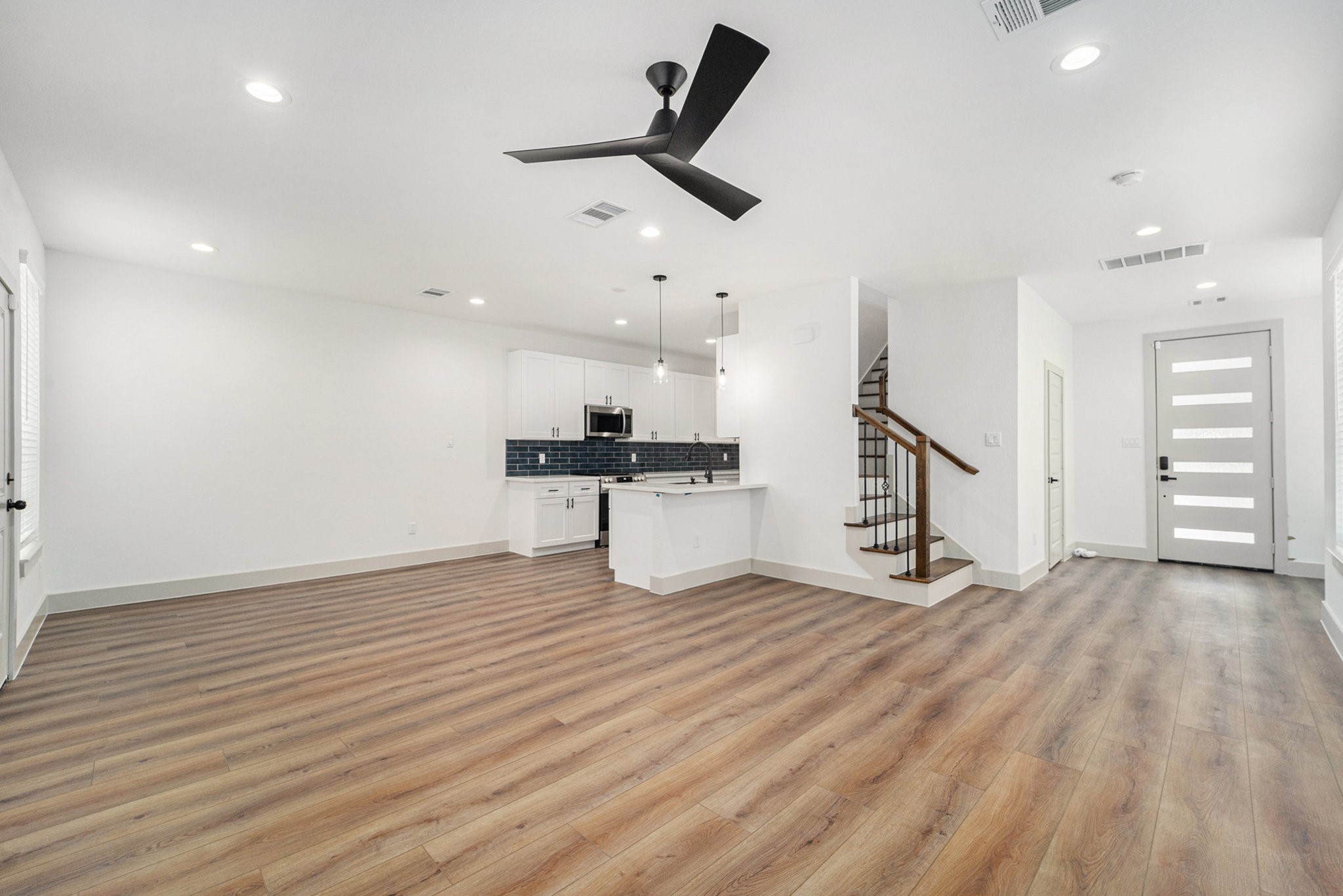 6425 Anderson Road, Unit B Houston, TX 77085 - Photo 16 of 36 wooden floor in an empty room with a window