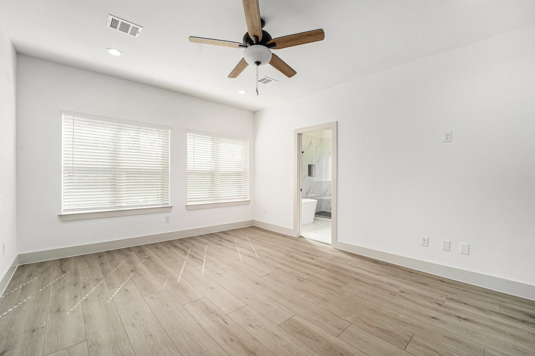 6425 Anderson Road, Unit B Houston, TX 77085 - Photo 17 of 36 wooden floor in an empty room with a window