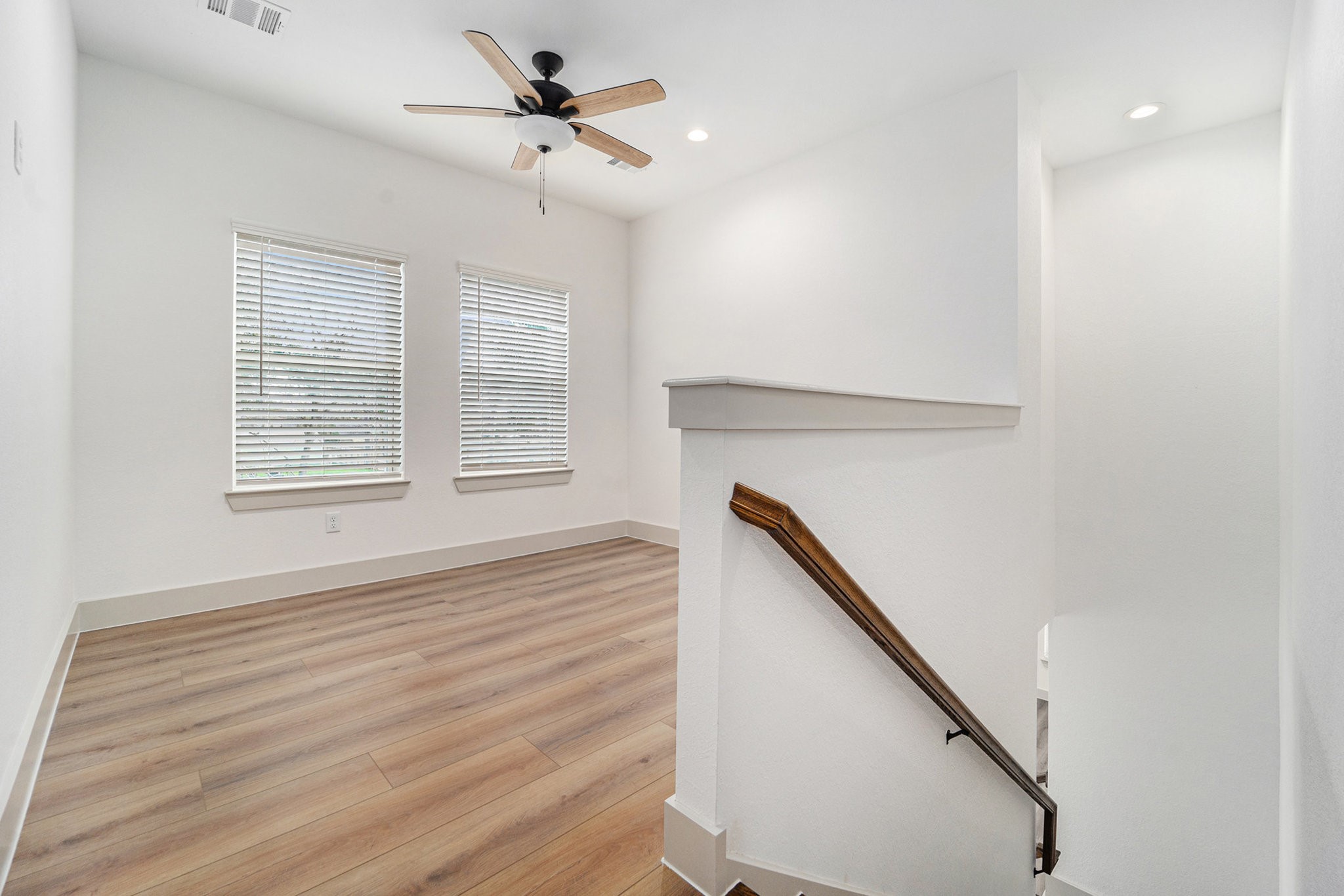 6425 Anderson Road, Unit B Houston, TX 77085 - Photo 18 of 36 a view of empty room with wooden floor and fan