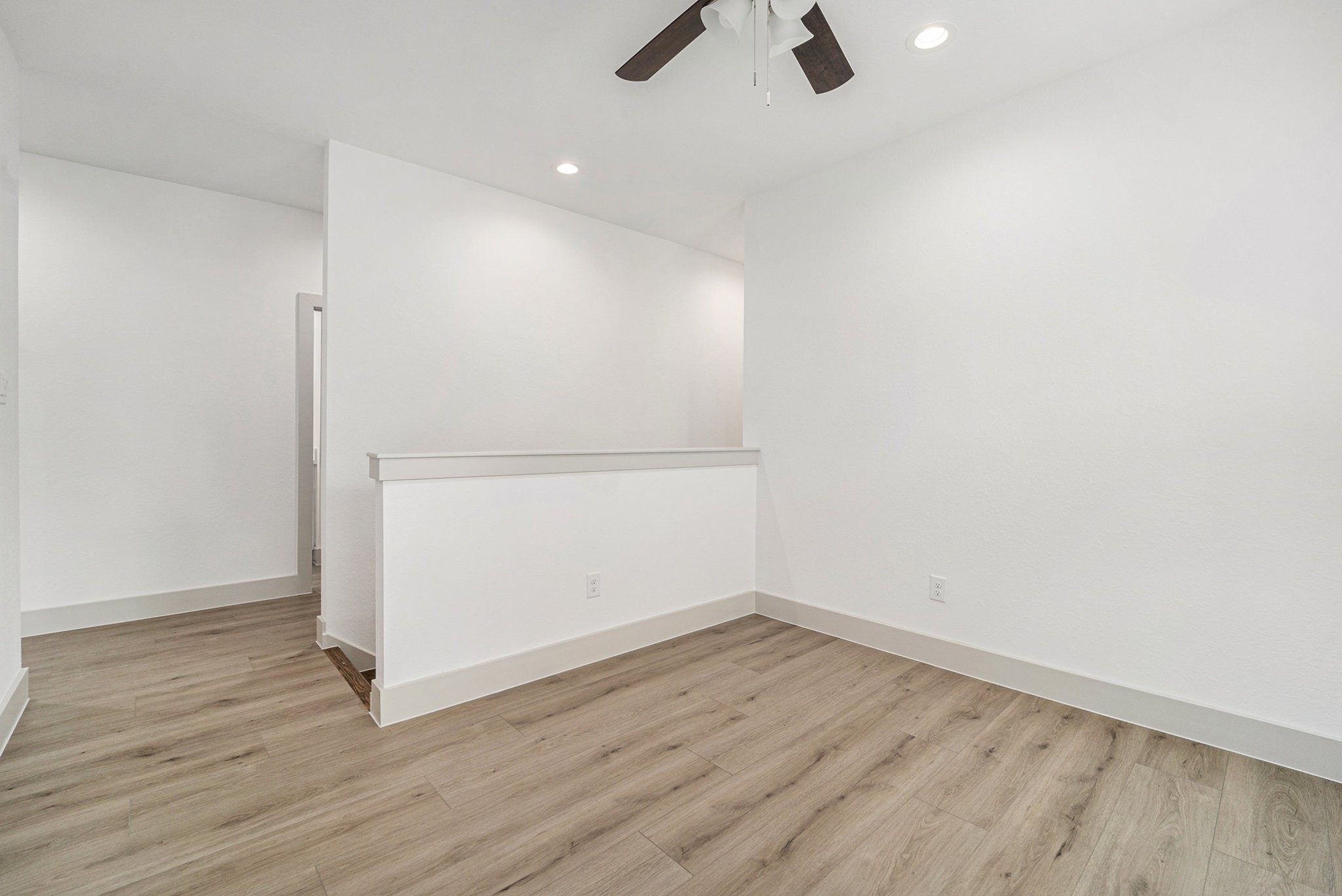 6425 Anderson Road, Unit B Houston, TX 77085 - Photo 25 of 36 an empty room with wooden floor