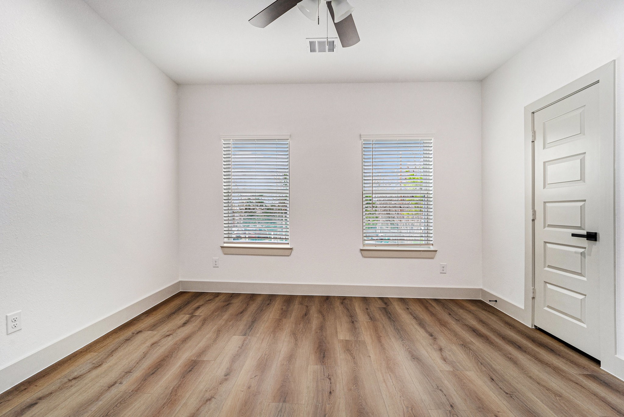6425 Anderson Road, Unit B Houston, TX 77085 - Photo 26 of 36 an empty room with a hardwood and windows
