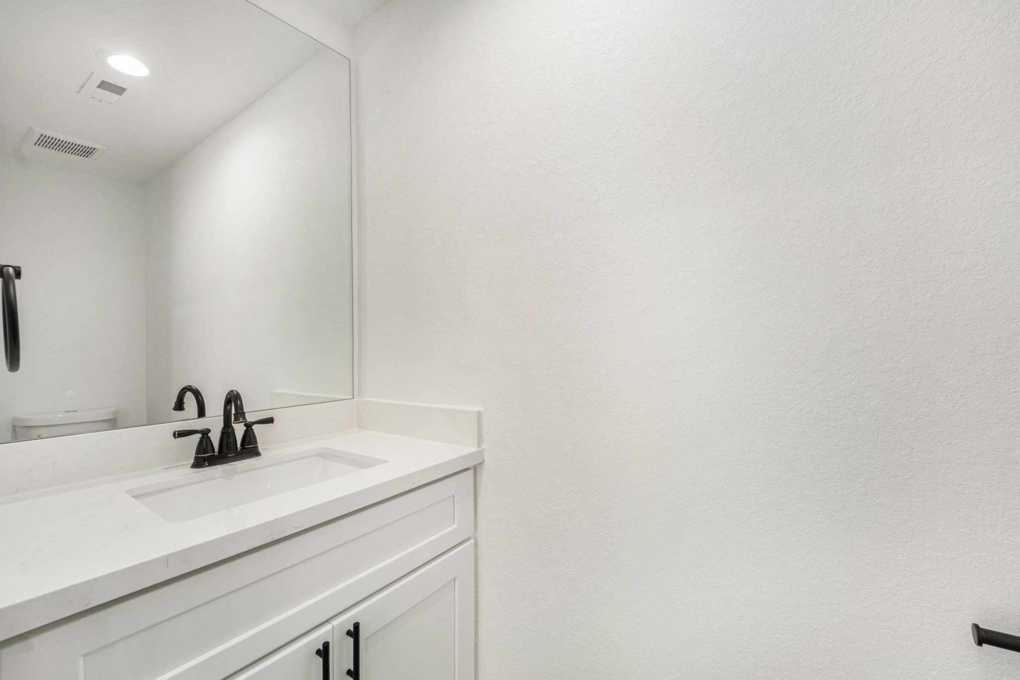 6425 Anderson Road, Unit B Houston, TX 77085 - Photo 27 of 36 a bathroom with a sink and mirror