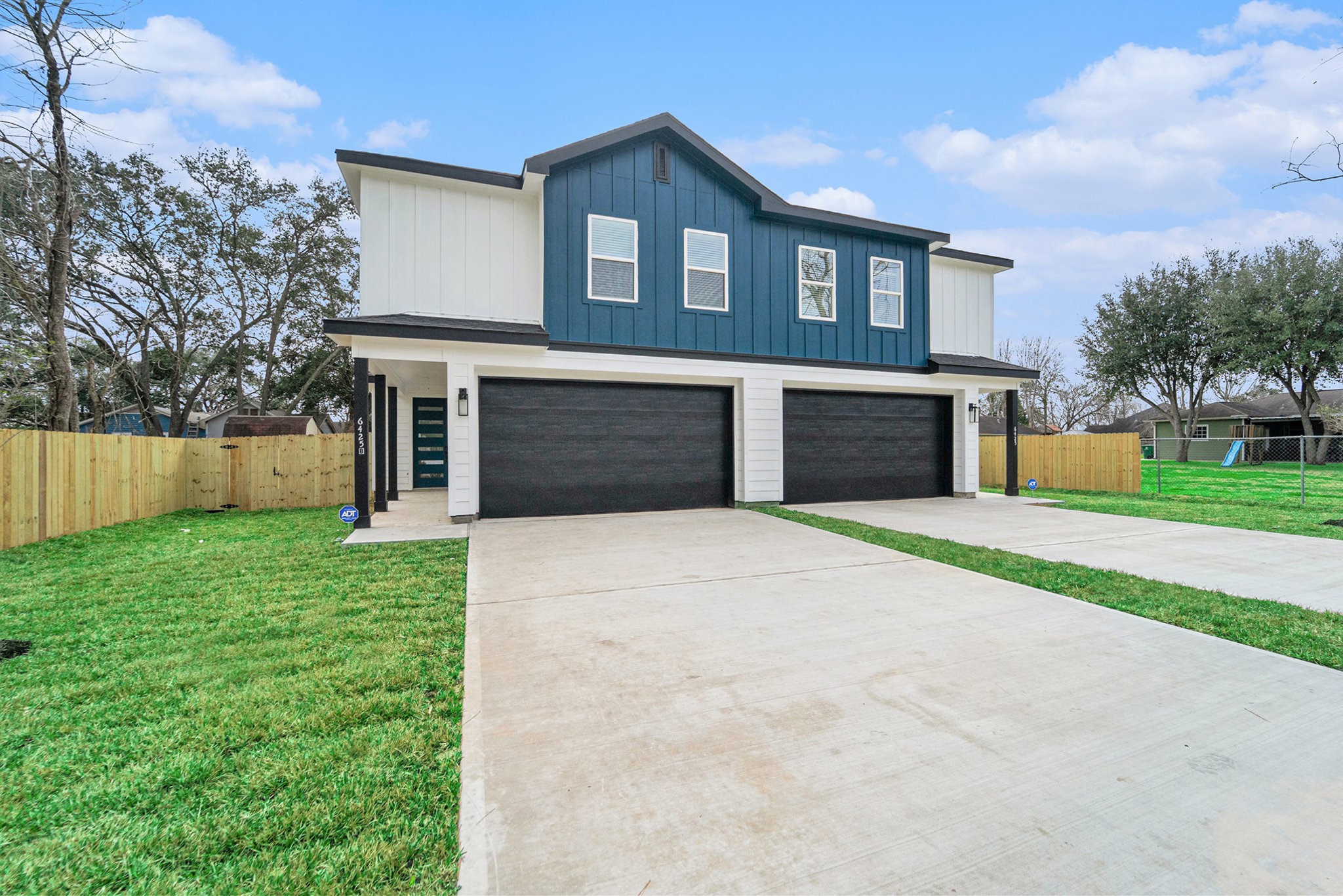 6425 Anderson Road, Unit B Houston, TX 77085 - Photo 3 of 36 a front view of a house with a yard and garage