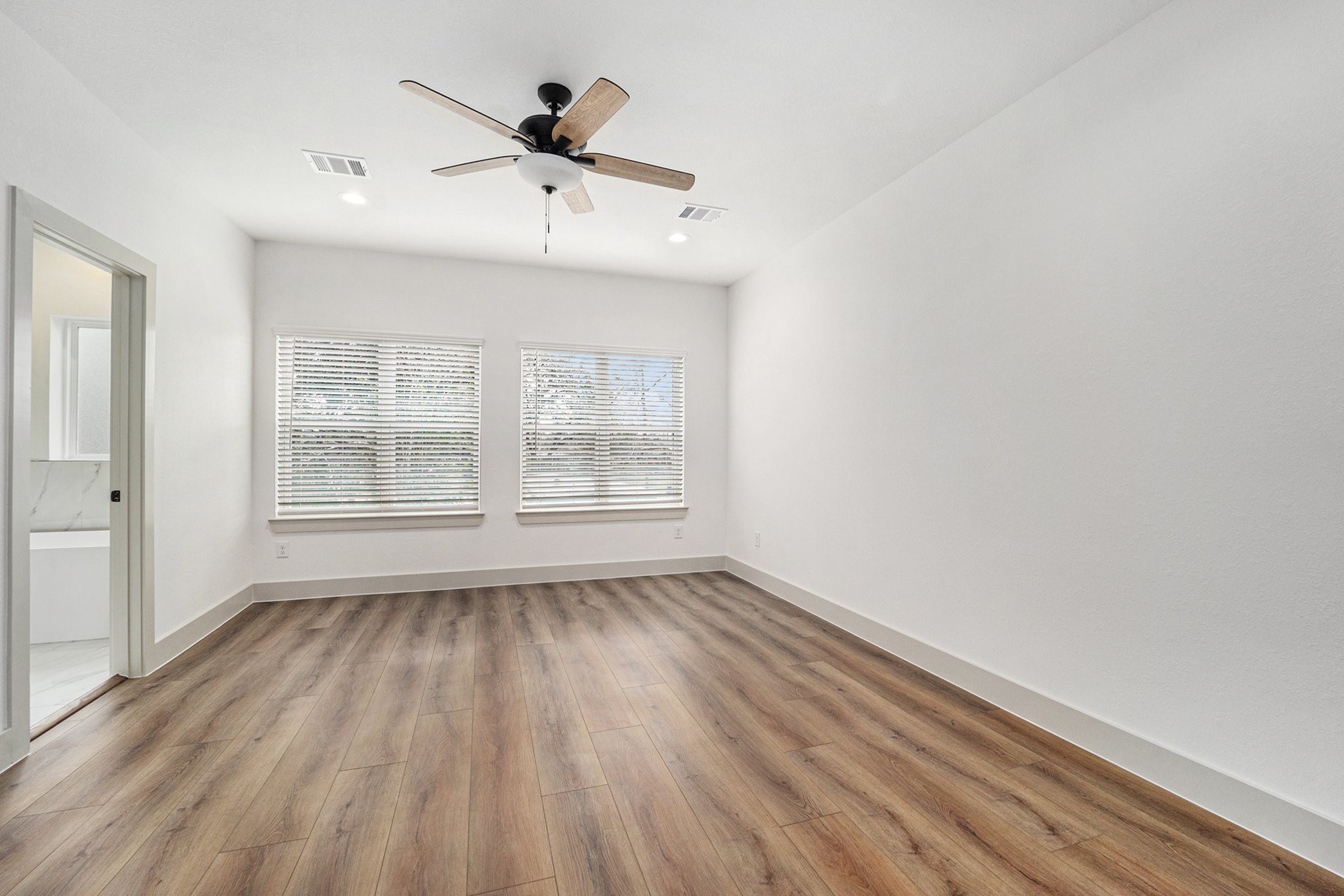 6425 Anderson Road, Unit B Houston, TX 77085 - Photo 32 of 36 wooden floor in an empty room with a window