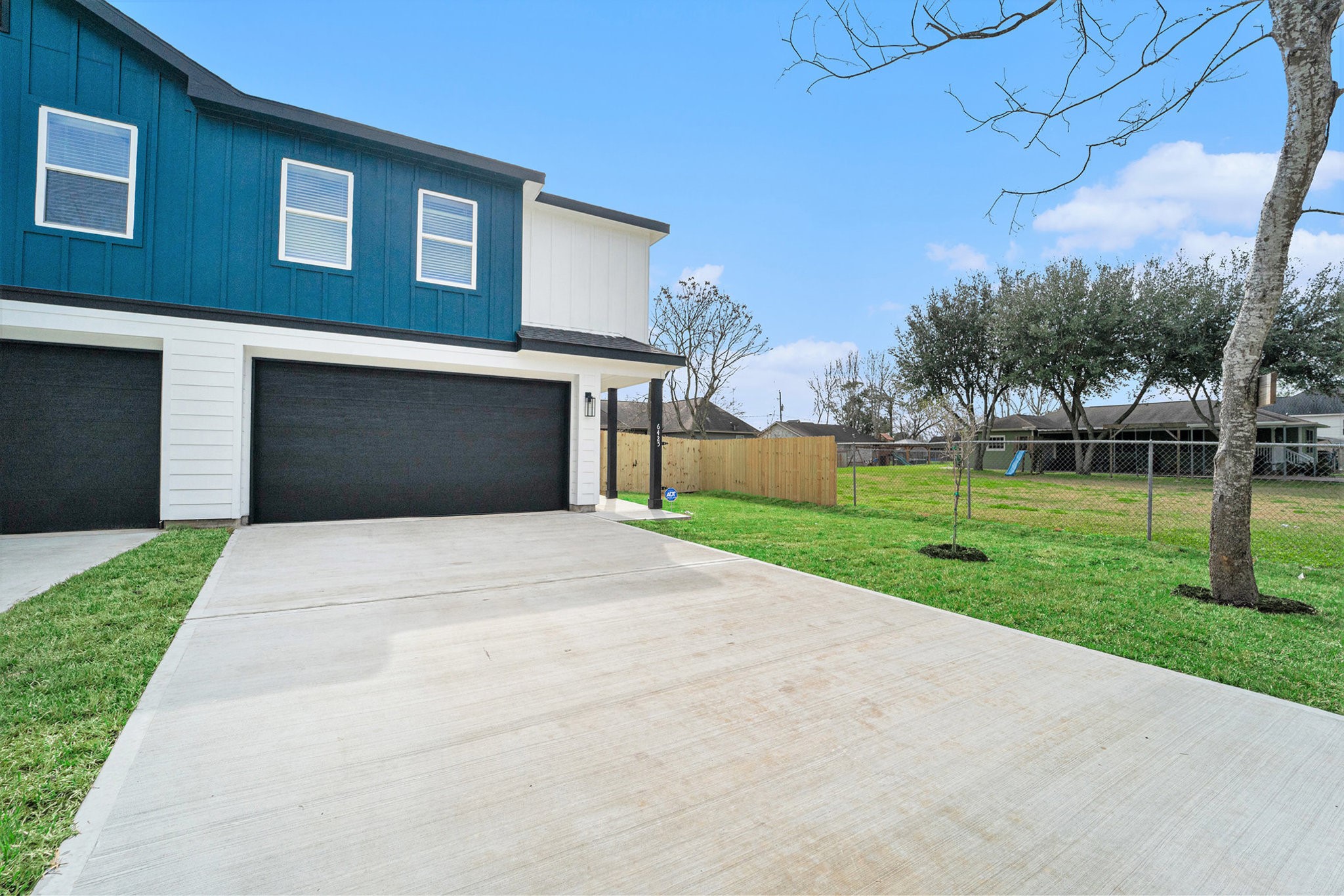 6425 Anderson Road, Unit B Houston, TX 77085 - Photo 4 of 36 a front view of a house with a yard and trees