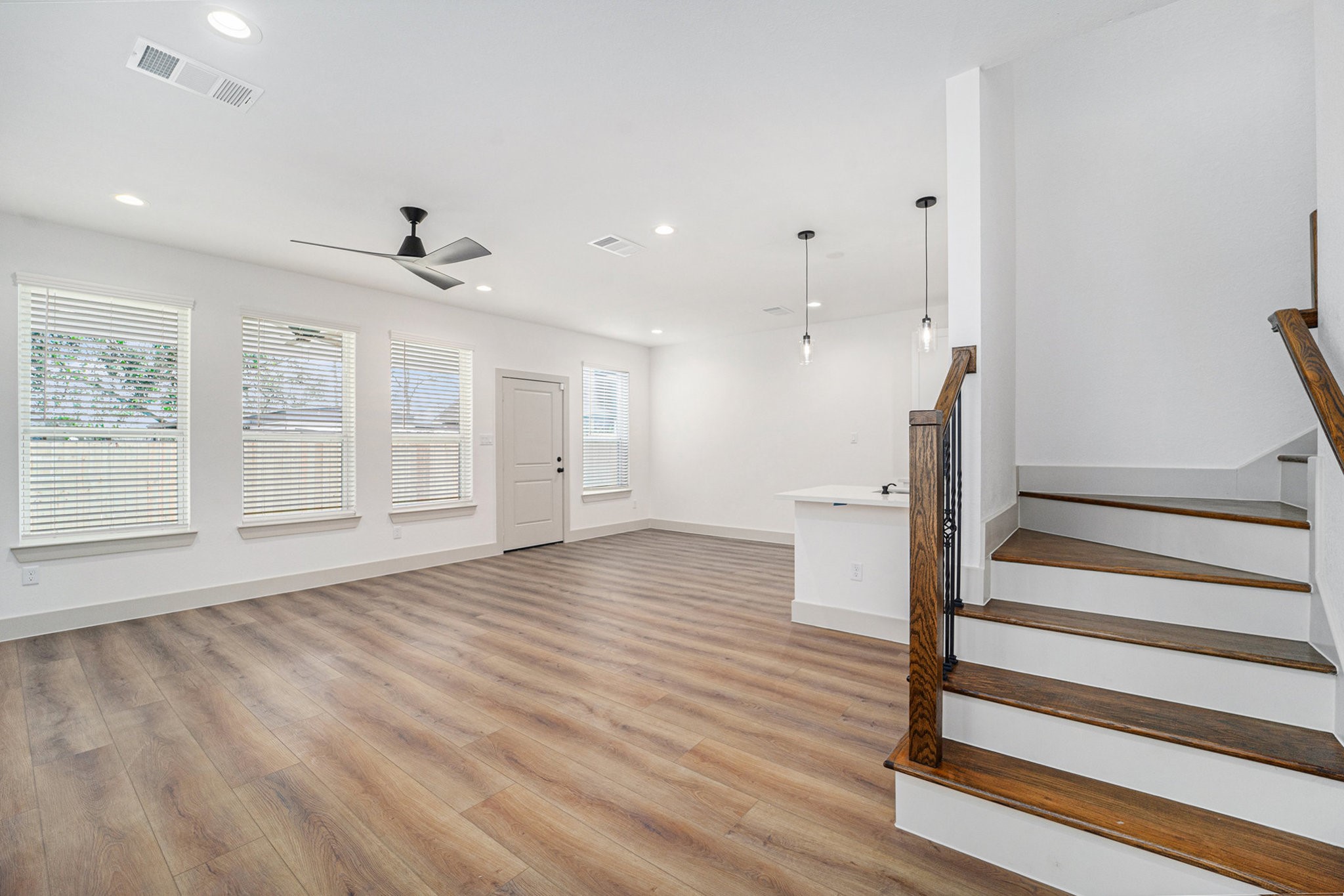 6425 Anderson Road, Unit B Houston, TX 77085 - Photo 7 of 36 a view of an empty room with wooden floor and a window