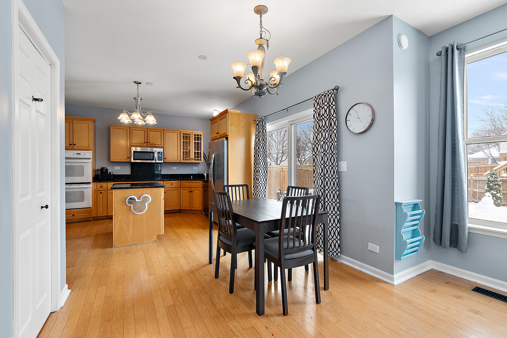 420 Wilshire Lane Bolingbrook, IL 60440 - Photo 11 of 41 a view of a dining room with furniture window and wooden floor